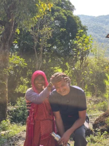 Local village host welcoming a guest at a homestay near Jim Corbett.