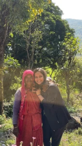 Female traveler hugging a local host at The Corbett Rajae Homestay